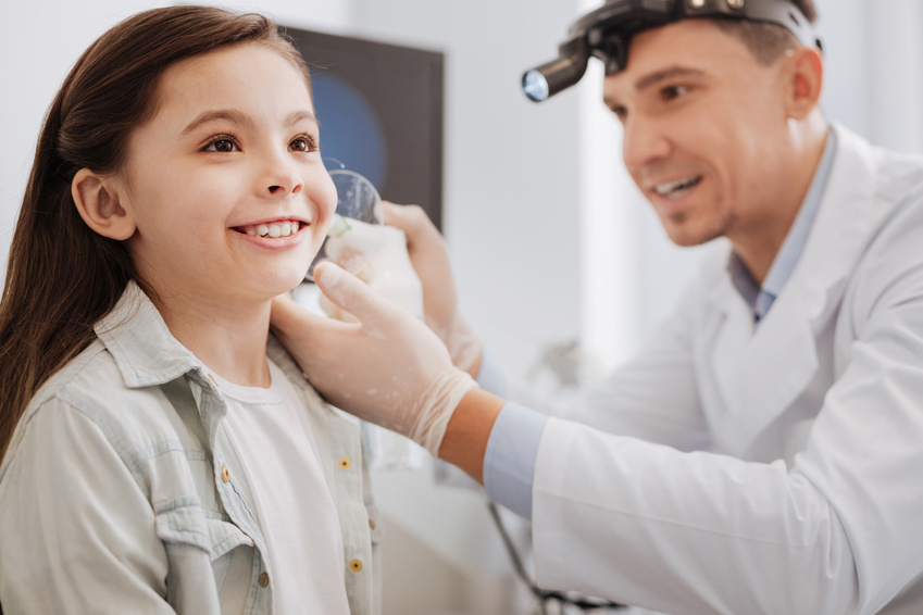 Portrait of girl while being at hearing examination Portrait of girl while being at hearing examination